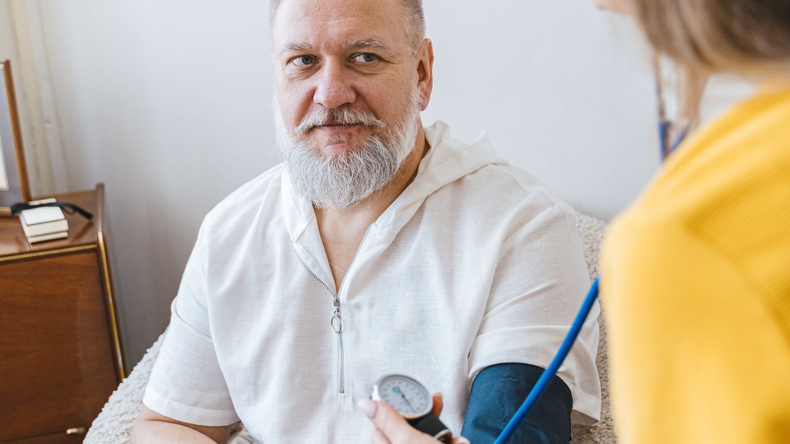 Mobile phlebotomist preparing a specimen collection kit at a patient's home